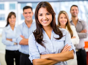 Businesswoman leading a business team and smiling