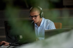 software developer working with headphones